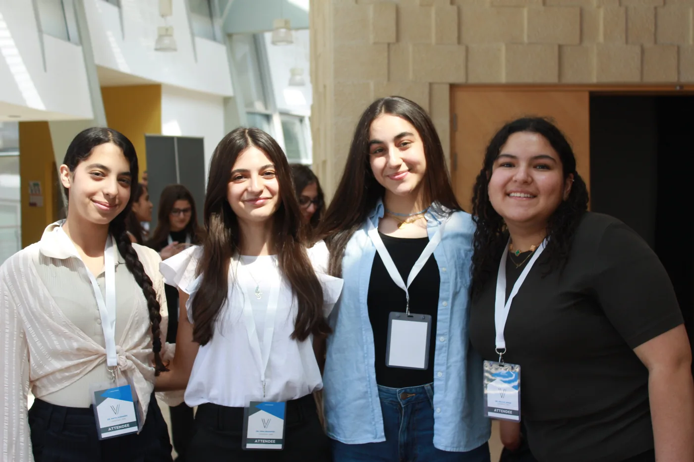 Four VocationX students smiling at an event in Amman
