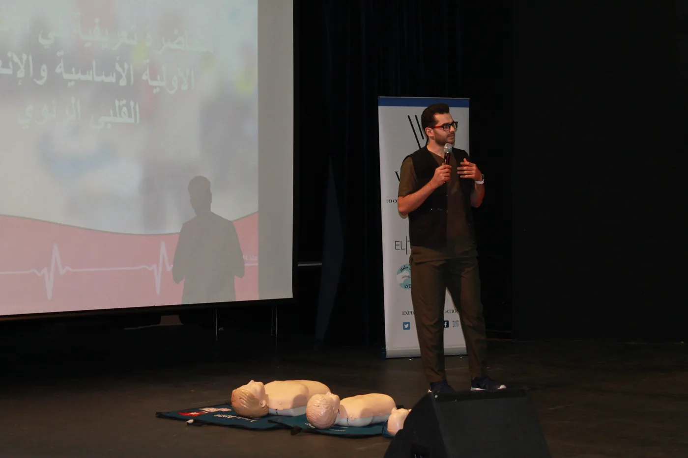 VocationX facilitator demonstrating CPR on training mannequins